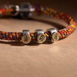 Buddha Stones Handmade Tibetan 925 Sterling Silver Chinese Zodiac Natal Buddha Zakiram Goddess of Wealth Protection Multicolored Rope Braided Bracelet Bracelet BS 18