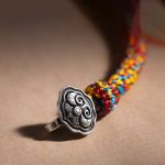 Buddha Stones Handmade Tibetan 925 Sterling Silver Chinese Zodiac Natal Buddha Zakiram Goddess of Wealth Protection Multicolored Rope Braided Bracelet Bracelet BS 3