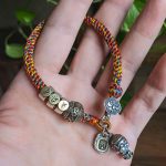 Buddha Stones Handmade Tibetan 925 Sterling Silver Chinese Zodiac Natal Buddha Zakiram Goddess of Wealth Protection Multicolored Rope Braided Bracelet Bracelet BS 21