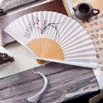 Buddha Stones Chinese Characters Ink Painting Lotus Flower Leaf Landscape Handheld Huayao Crepe Polyester Bamboo Folding Fan 23.3cm Folding Fan BS Orchid 23.3cm