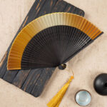 Buddha Stones Solid Color Gradient Hollow Engraved Handheld Bamboo Folding Fan Folding Fan BS Yellow Gradient 21.5cm