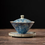 Buddha Stones Vintage Blue And White Porcelain Peach Blossom Lotus Peony Ceramic Gaiwan Sancai Teacup Kung Fu Tea Cup And Saucer With Lid Cup BS 10.2cm*8.8cm*130ml(Saucer 11.4cm)