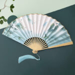 Buddha Stones Retro Lotus Flower Leaf Mountain Lake Handheld Folding Fan With Bamboo Frames Folding Fan BS Mountain Bamboo Lake Beige Bamboo Frames