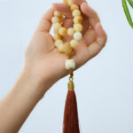 Buddha Stones Natural Bodhi Seed Ivory Fruit Dancing Lion Charm Harmony Tassel Wrist Mala Wrist Mala BS 4