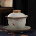 Buddha Stones Lotus Koi Fish Pod Leaf Ceramic Gaiwan Sancai Teacup Kung Fu Tea Cup And Saucer With Lid 140ml Cup BS Pink Lotus Koi Fish 11.5cm*9.5cm*140ml