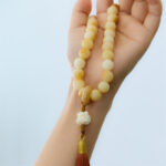 Buddha Stones Natural Bodhi Seed Ivory Fruit Dancing Lion Charm Harmony Tassel Wrist Mala Wrist Mala BS 3