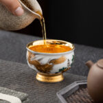 Buddha Stones Golden Eagle Auspicious Dragon Sun Ocean Waves Gilt Ceramic Teacup Kung Fu Tea Cup Cup BS 2